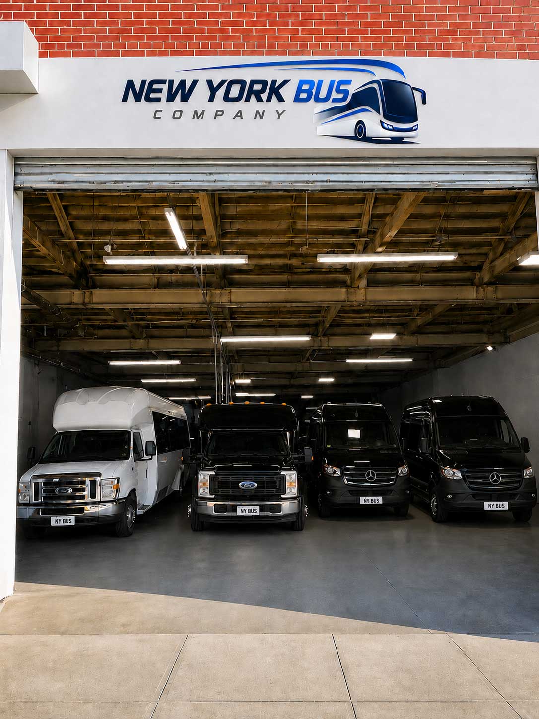 New York Bus Company sprinter vans and minibuses parked inside the Brooklyn garage