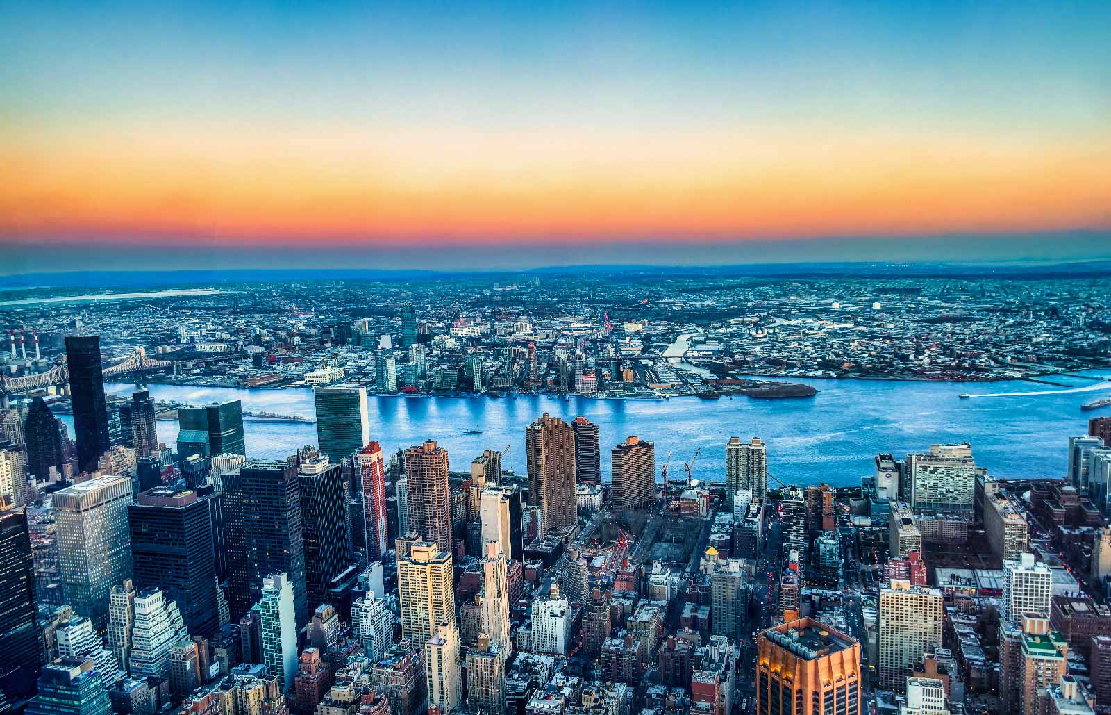 Aerial view across Queens toward the Manhattan skyline